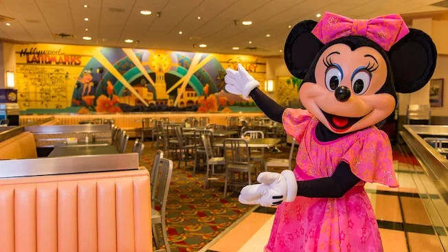 Minnie shows off the dining room of the Hollywood & Vine Restaurant